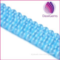 light blue round cut glass cat eye beads